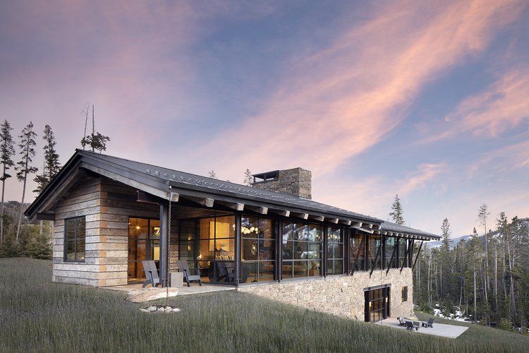 Optimum architectural steel windows and doors on a mountain home, manufacturer photo